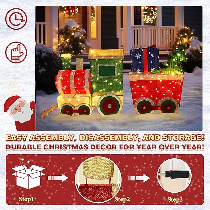 Lit Christmas train decor set with green engine, red cars, and warm-white lights on snow