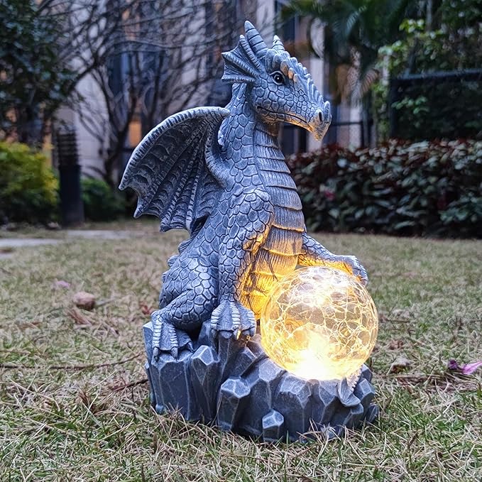 Blue dragon garden statue with glowing orb and jagged stone base, solar light