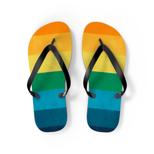 Striped flip flops with V-shaped black thong straps and rainbow stripe footbed
