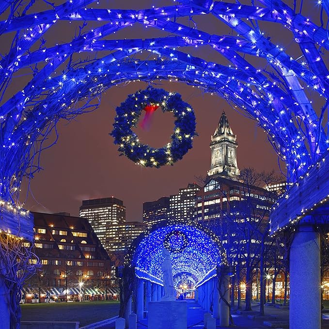 Blue LED mini string lights forming an arch canopy with wreaths for outdoor decor