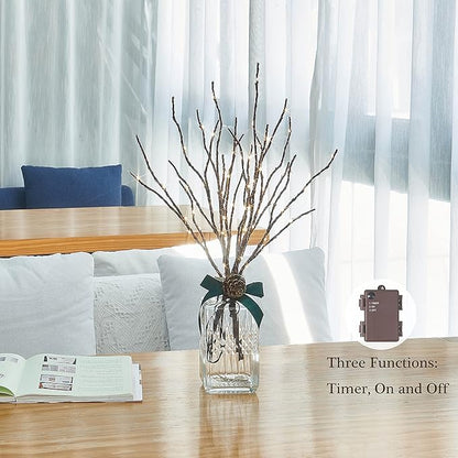 Brown lighted willow branch set in clear glass vase with warm white LEDs, timer box