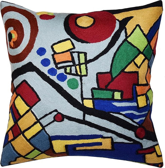 Embroidered abstract geometric pillow cover in red, blue, green on light blue