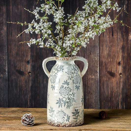 Vintage ceramic pitcher vase with arched handles, blue floral pattern on white crackle glaze