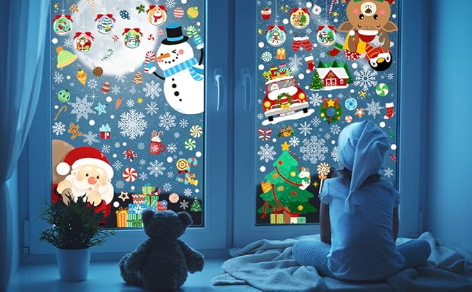 Christmas window clings with snowman, Santa, reindeer and snowflakes on blue window