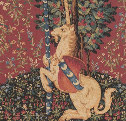 Close-up unicorn tapestry pillow cover with burgundy, blue, and green floral background