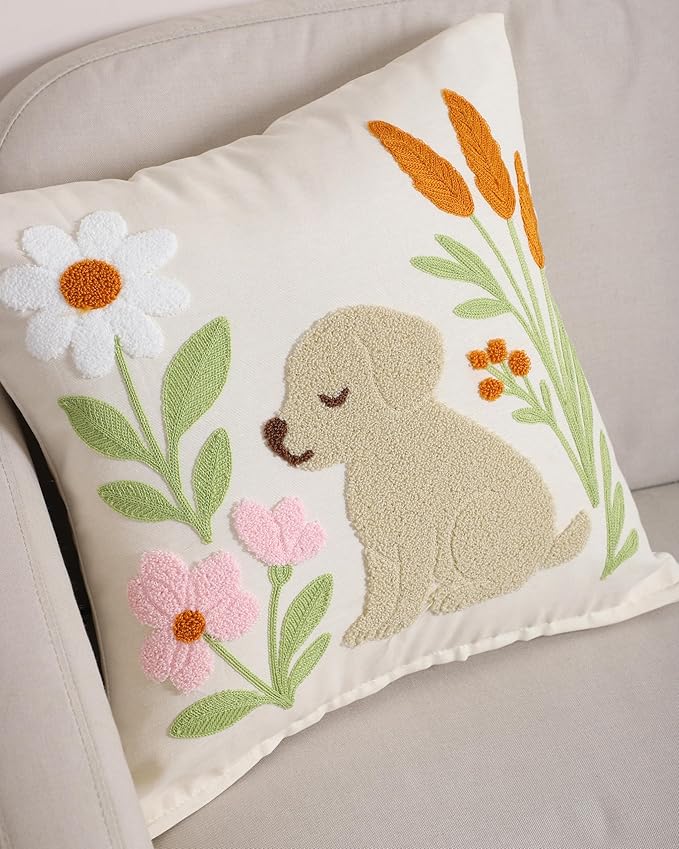 Embroidered cream pillow cover featuring tan dog face and green floral stems