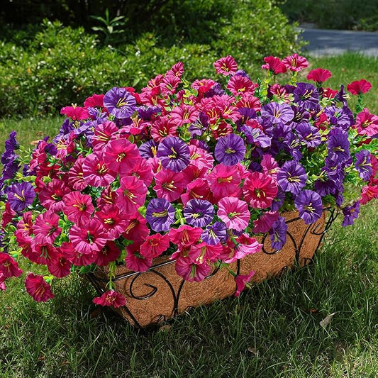 Faux morning glory bundles with purple and fuchsia blossoms in a rectangular planter.