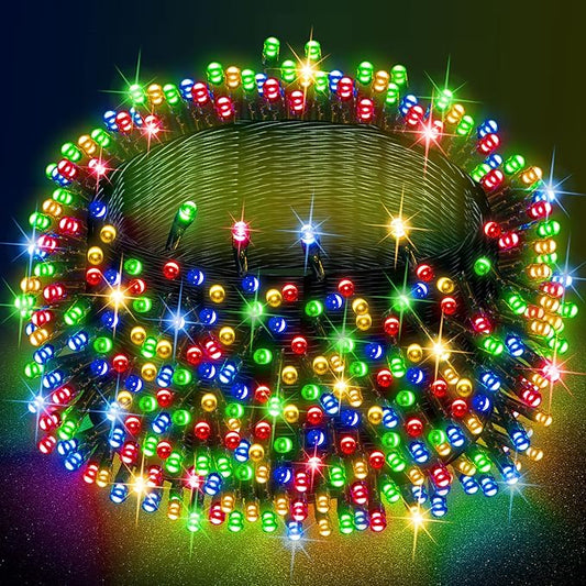 Colorful LED Christmas string lights on green wire, multicolored bulbs.