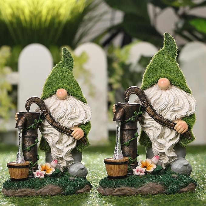 Two solar-powered resin garden gnome statues with green caps, white beards, and lanterns