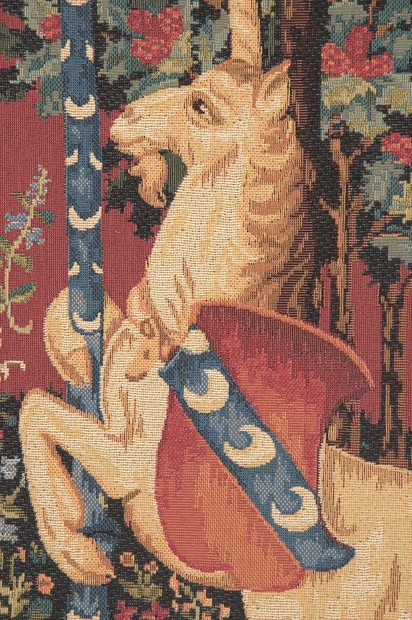 Close-up unicorn tapestry design on square pillow cover with burgundy, blue, and gold tones