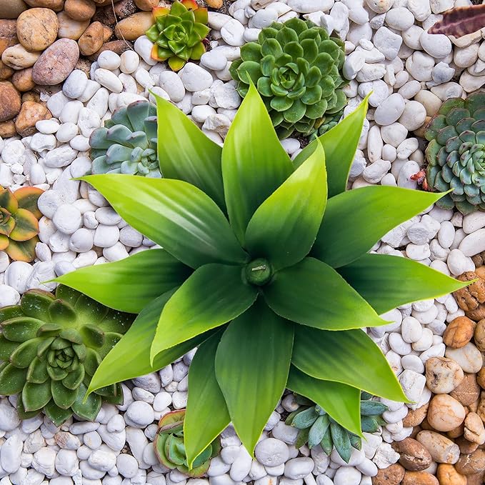 Green faux agave plant with wide spiky leaves, top view