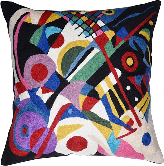 Black abstract embroidered decorative pillow cover with colorful geometric shapes, front view.