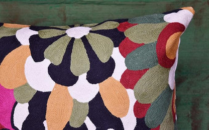 Multicolor embroidered floral pillow cover with curved petal shapes and black border