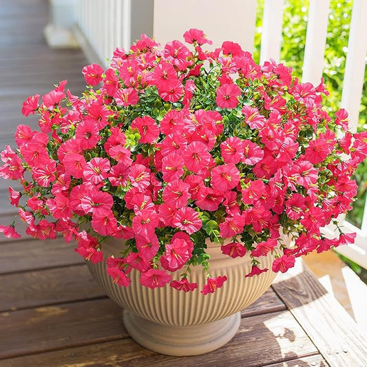 Hot pink faux morning glory flower bundle with green leaves, in a beige pot