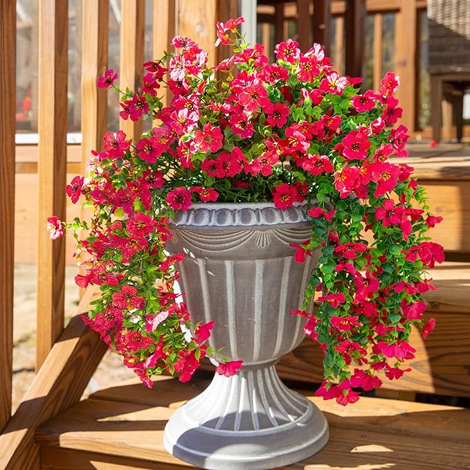Hot pink faux daisy hanging flower bundles with cascading green trailing stems