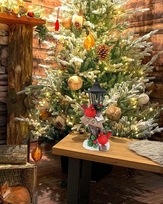 Lighted resin cardinal ornament with black lantern, red birds, and JOY sign on holiday display