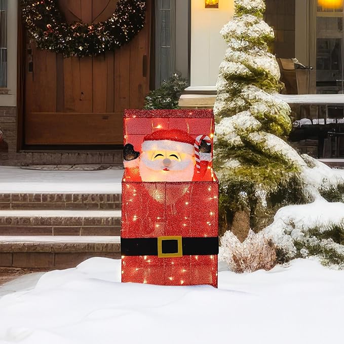 Illuminated electric Santa Claus decor in a red glitter gift box with warm lights