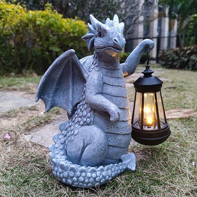 Blue dragon garden statue with raised tail and glowing lantern on patio