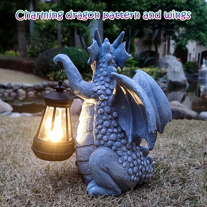 Blue dragon garden statue with open wings and glowing lantern close-up