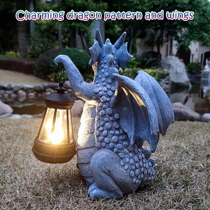 Blue dragon garden statue with open wings and glowing lantern close-up