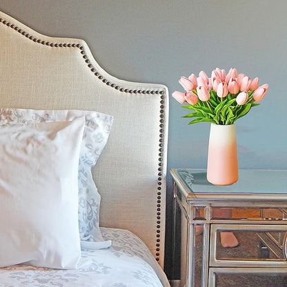 Light pink faux tulip bouquet in small gradient pink vase with green stems
