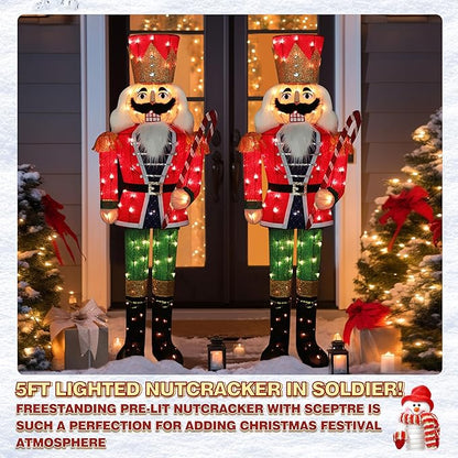 Two lit nutcracker soldiers in red coats and green pants with warm white lights