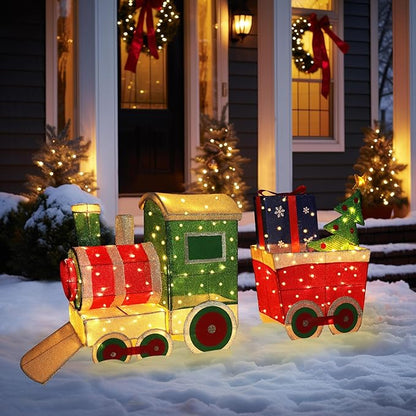 Light-up Christmas train decor set with green engine, red cars, and gift boxes on snow