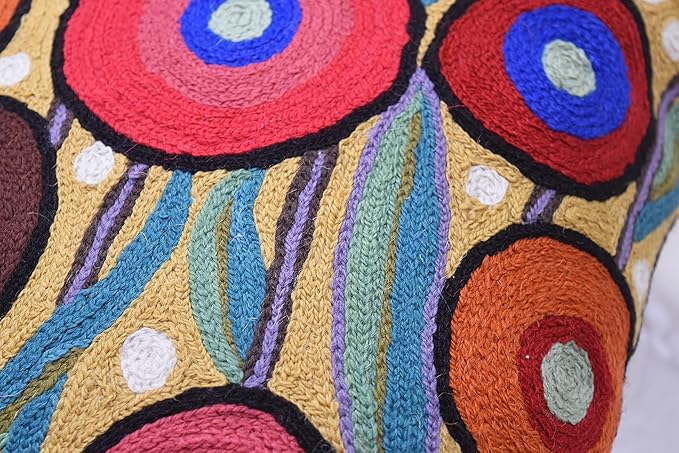 Embroidered pillow cover with teal striped rays and multicolor circular flower shapes
