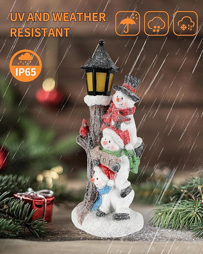 Weatherproof lighted stacked snowman figurine with glowing lantern and snowy base