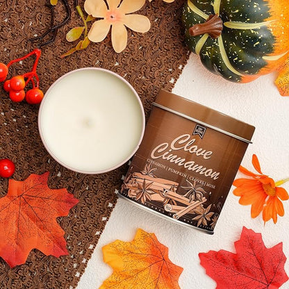 Clove Cinnamon soy candle in brown tin with open top and visible pale wax pool