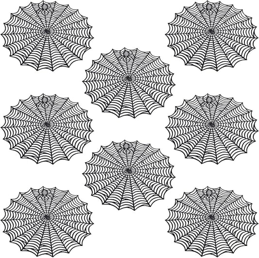 Set of round black spider web PVC table placemats with bold radial web pattern