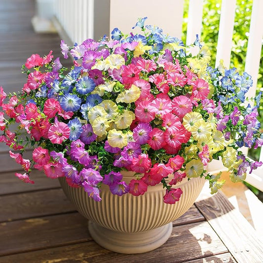 Multicolor faux morning glory flower bundle with green leaves in a cream pot