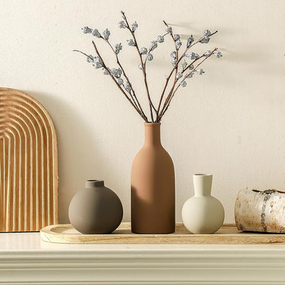 Set of 3 matte ceramic vases, including tall terracotta and two smaller bottle shapes