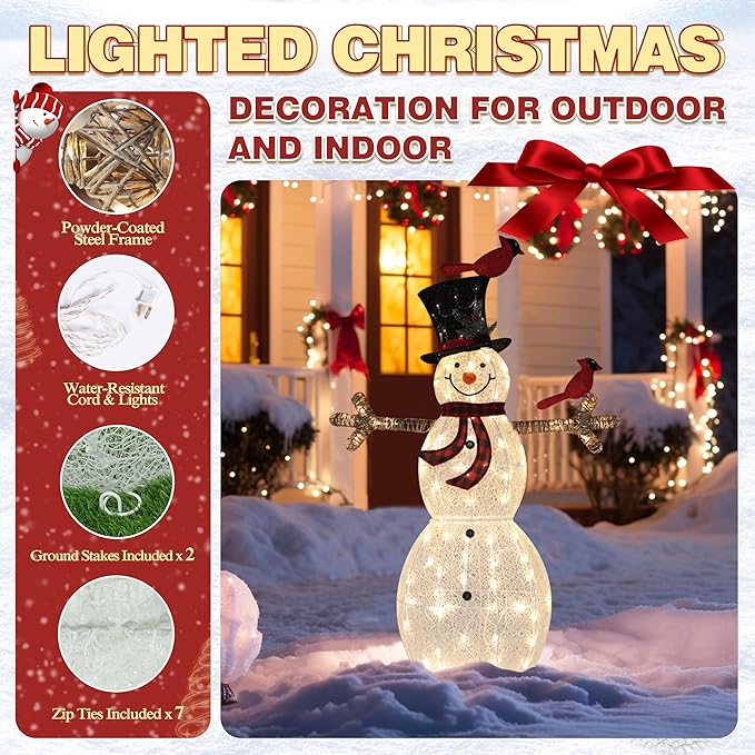 Lit glitter snowman with red birds, black top hat, and scarf, standing outdoors