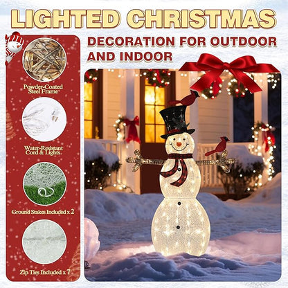 Lit glitter snowman with red birds, black top hat, and scarf, standing outdoors