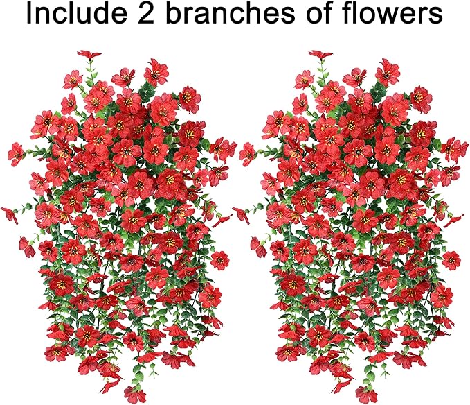 Two red faux hanging flower bundles with dense green vines and small red blossoms
