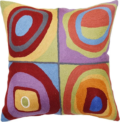 Square pillow cover with abstract concentric circles in red, blue, purple, green