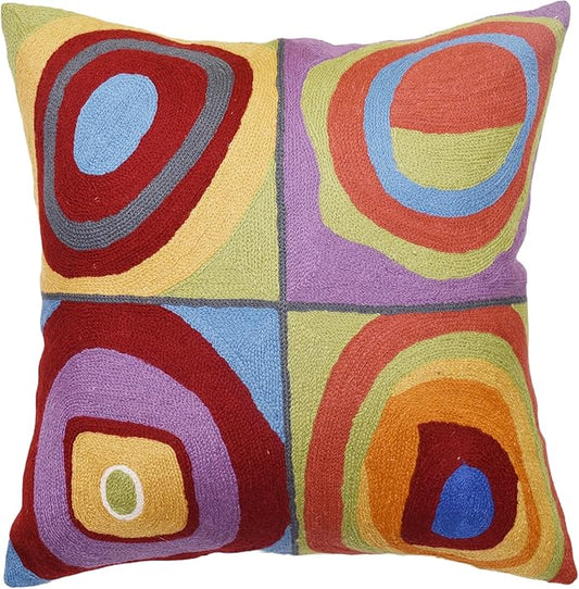 Square pillow cover with abstract concentric circles in red, blue, purple, green