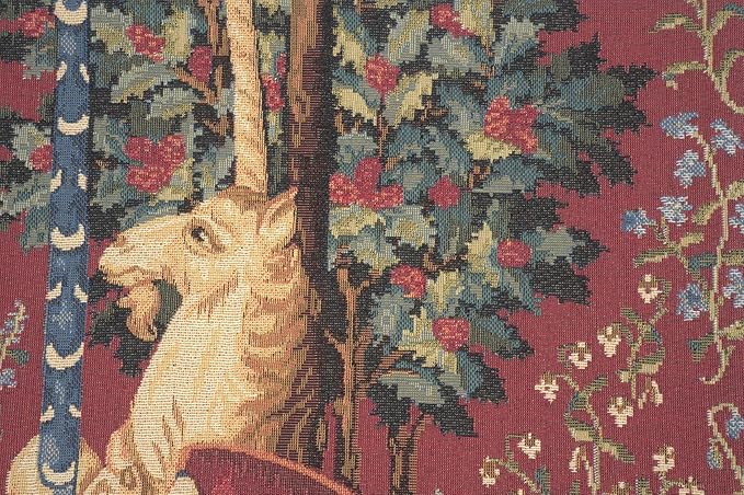 Unicorn tapestry pillow cover close-up showing unicorn head, flowers, and foliage on burgundy