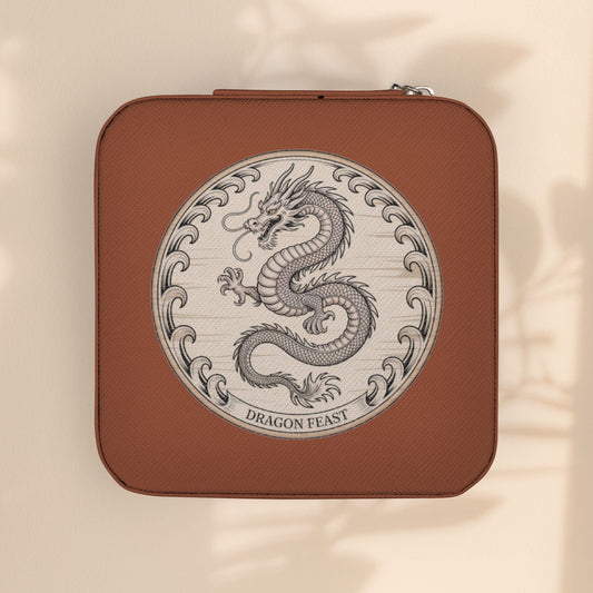 Compact jewelry travel case in brown with round dragon emblem on the front.