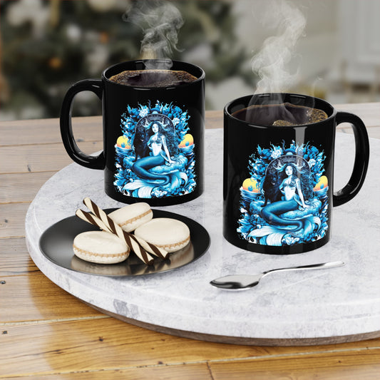 Pair of black 11oz coffee mugs with blue mermaid artwork on a serving tray