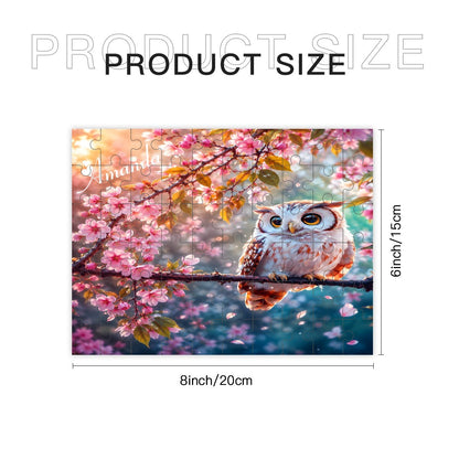 Jigsaw puzzle artwork with an owl and pink blossoms, shown with size dimensions