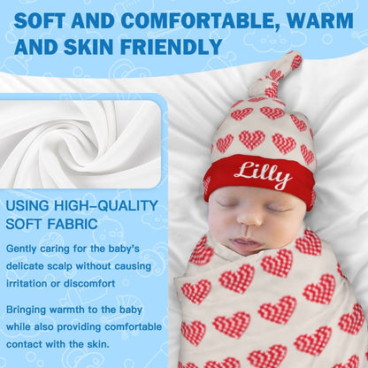 Red heart-print baby hat with swaddle blanket fabric close-up