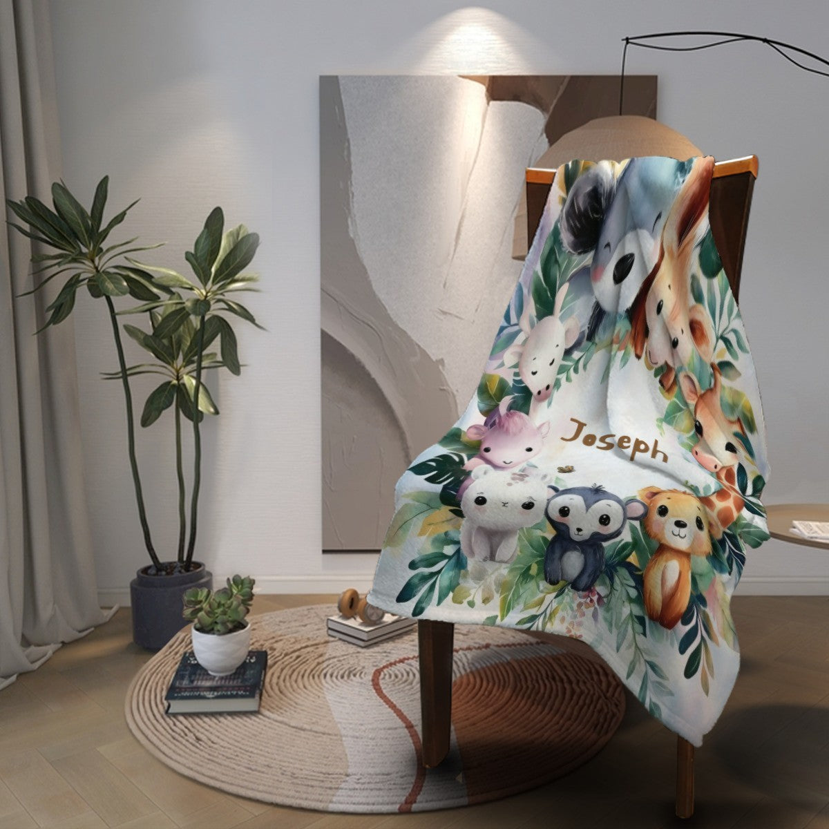 Safari animals blanket with name Joseph, draped on chair with leafy animal print on white