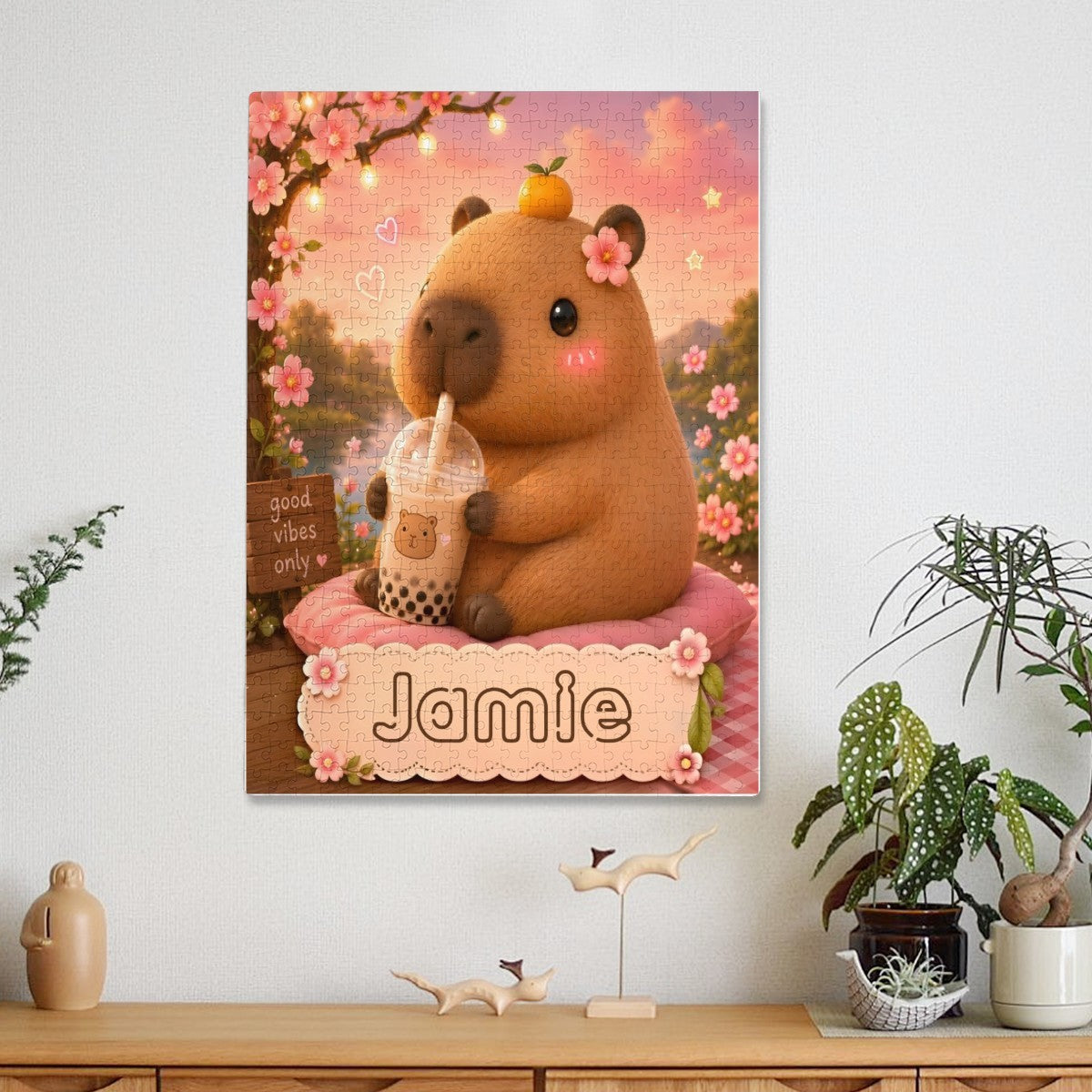 Jigsaw puzzle artwork on display: brown bear holding a drink, “Jamie” floral panel