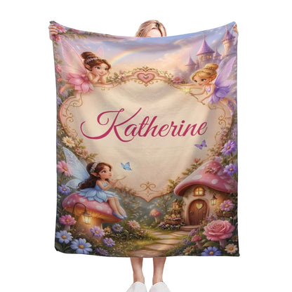 Personalized kids blanket with fairies, a cottage, flowers, and the name “Katherine”