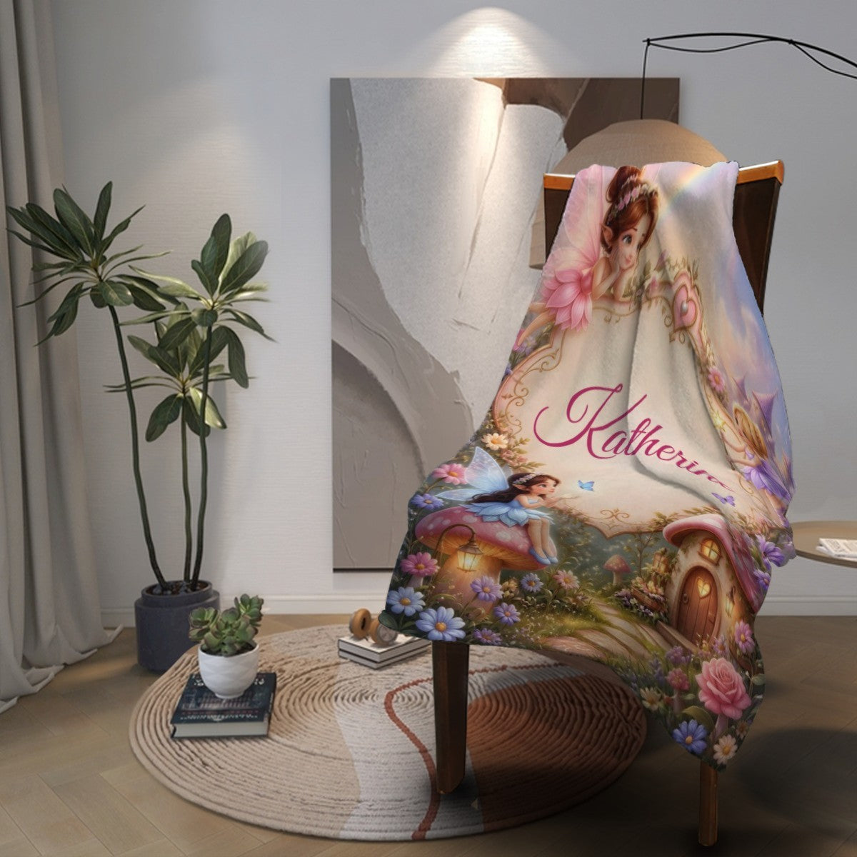 Personalized blanket draped over chair with “Katherine” script and fairy cottage scene