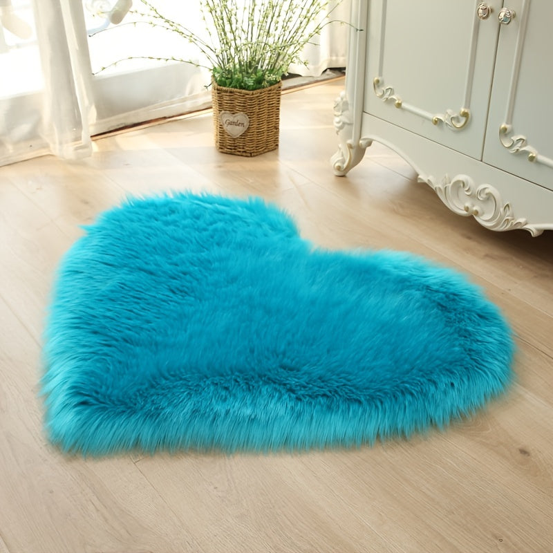 Heart-shaped faux fur rug with long shag pile, bright blue plush carpet mat.