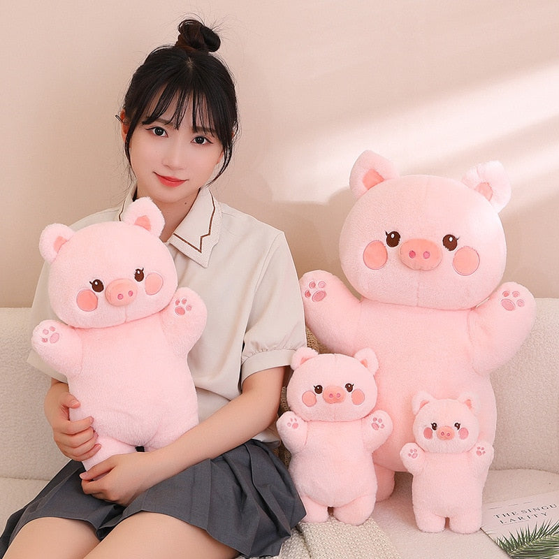 Pink pig plush set with three cute pig figures in different sizes