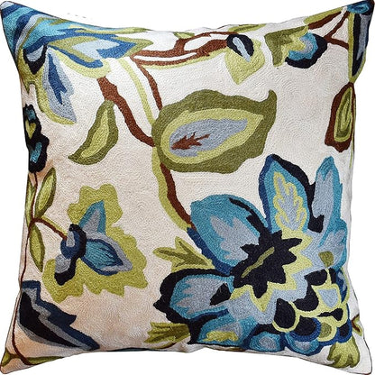 Floral decorative pillow cover in cream with blue and green flower needlepoint design